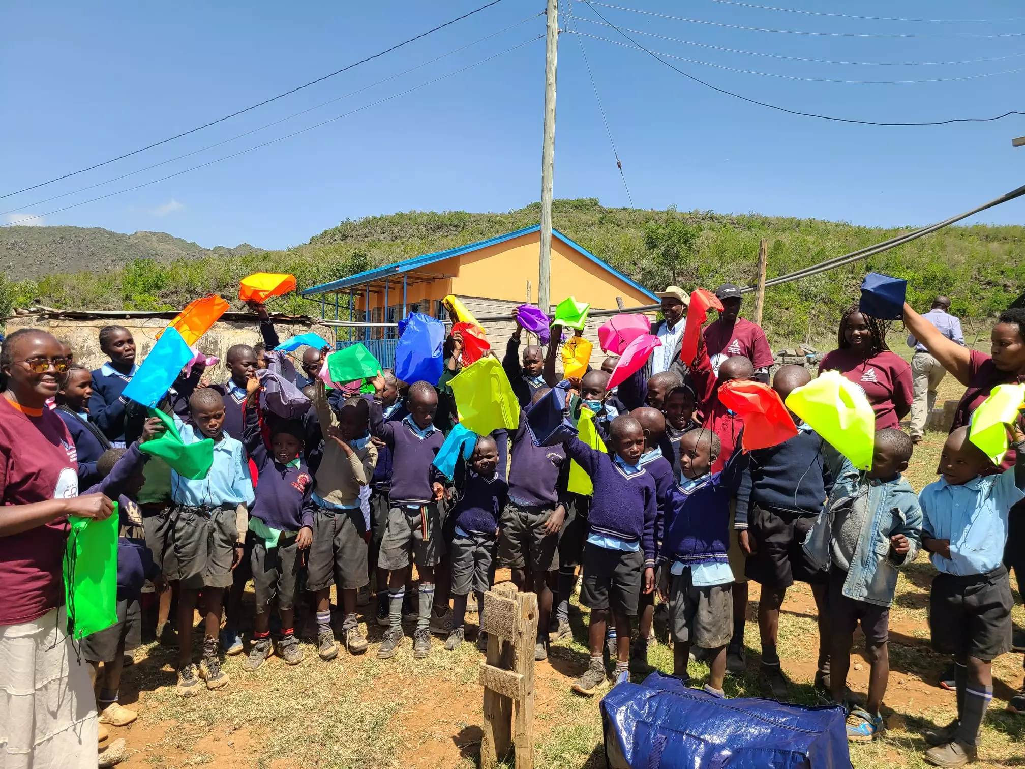 School bags being distributed to primary school students